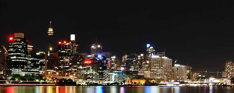 A large red circle on blue background illuminated on a building