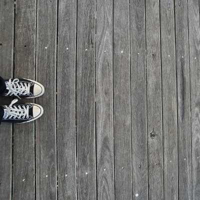 A pair of shoes on wooden planks
